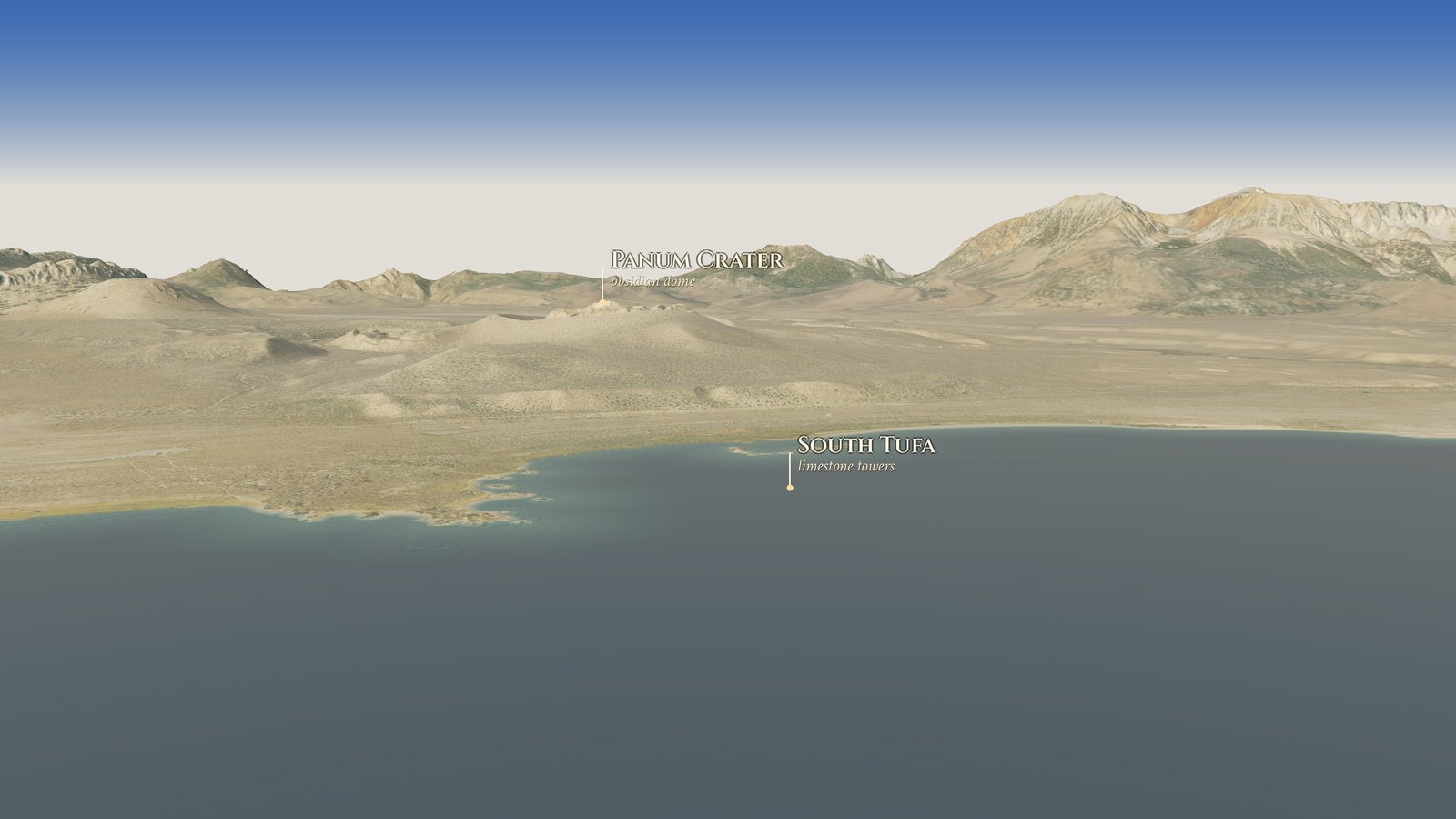 Low over Mono Lake looking south to the shore near South Tufa, with Panum Crater beyond and the Sierra Nevada on the horizon