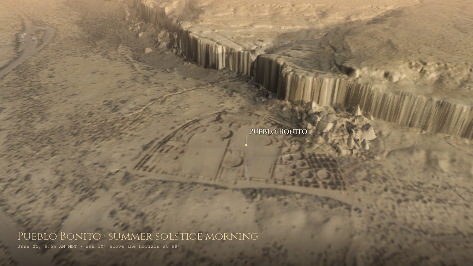 Pueblo Bonito from the air an hour after the June sunrise: the D-shaped great house with its room blocks and round kivas, the north canyon wall behind it and the boulders of Threatening Rock, which fell in 1941