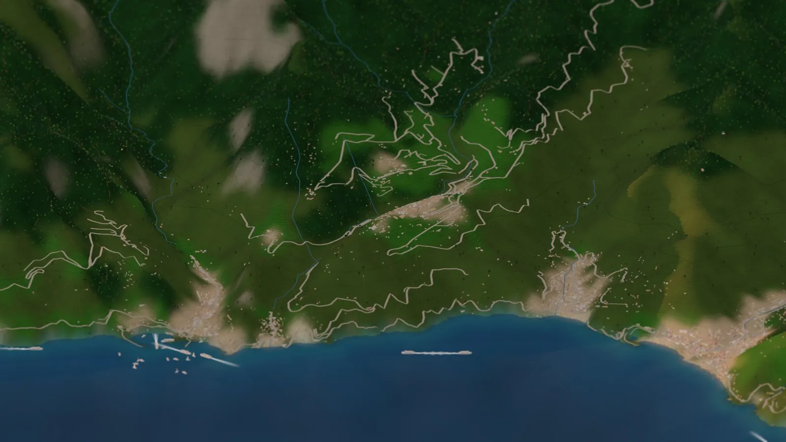 Ravello on its green ridge in the miniature coast in warm evening light, with Atrani and Amalfi at the water's edge below on the left, Minori on the right, and the roads winding up the valleys between them