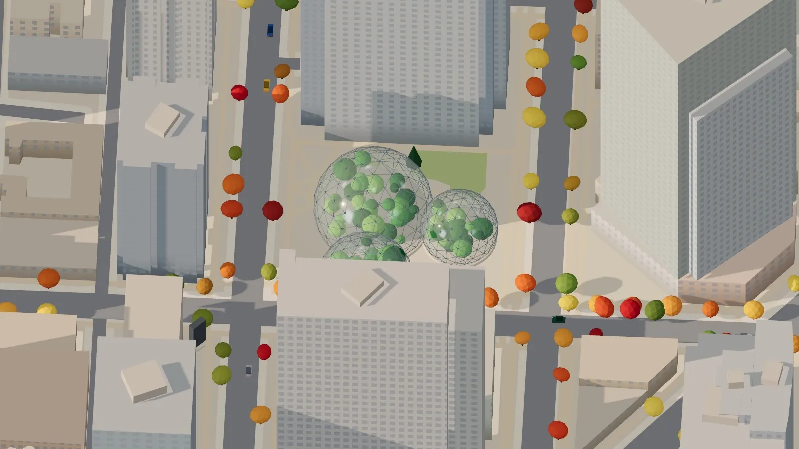 Looking down on the three glass Spheres in their plaza between tall office towers, with green plants visible through the geodesic glass