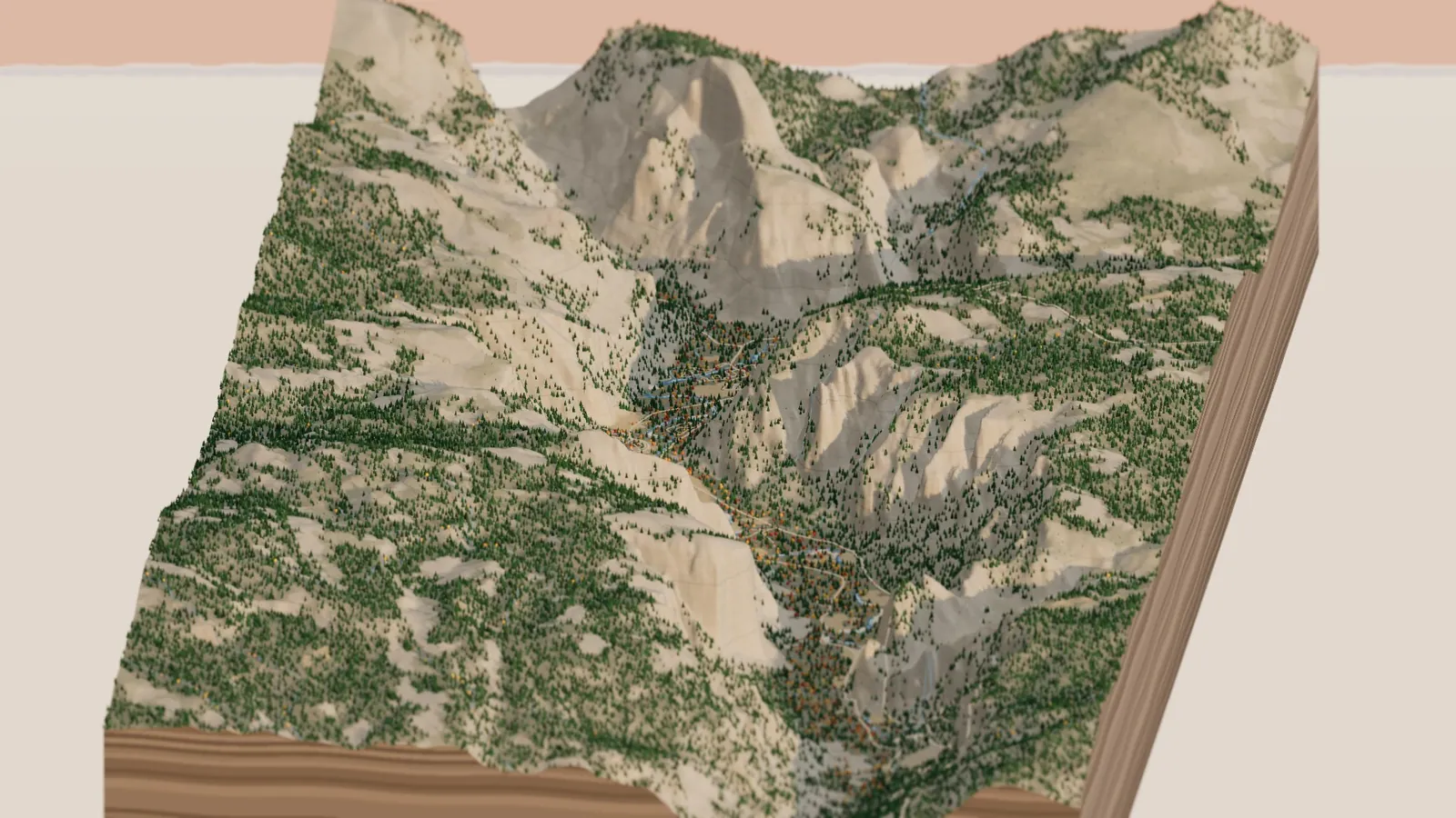 The miniature Yosemite Valley seen from the west in late afternoon: El Capitan on the left, Cathedral Rocks on the right, and Half Dome at the far end, with forest on the rims and gold oaks along the valley floor