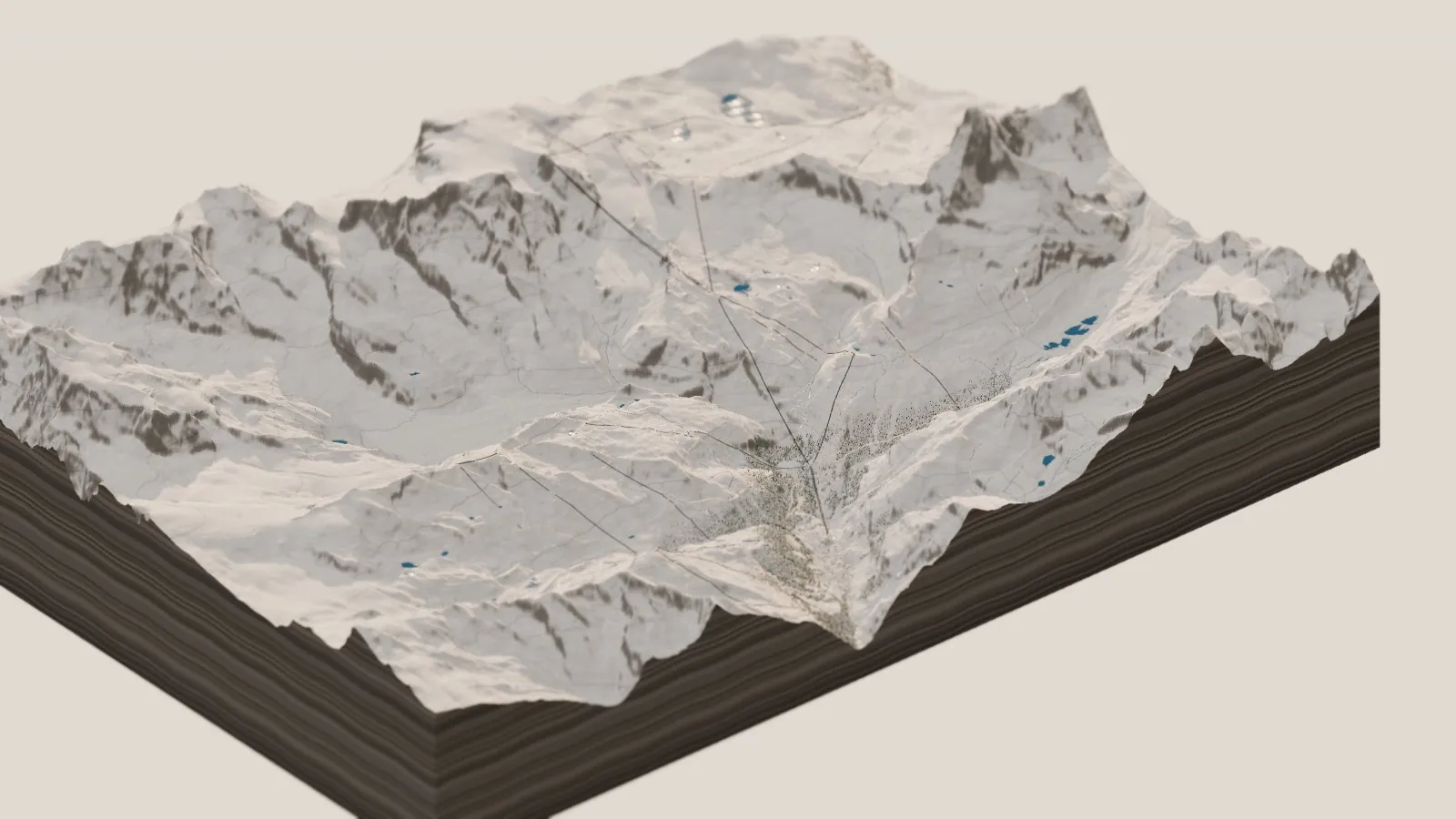 The whole miniature Zermatt in winter: snow from the valley floor to the summits, the Matterhorn and the peaks around it white, and the lift lines and ski runs drawn across the slopes